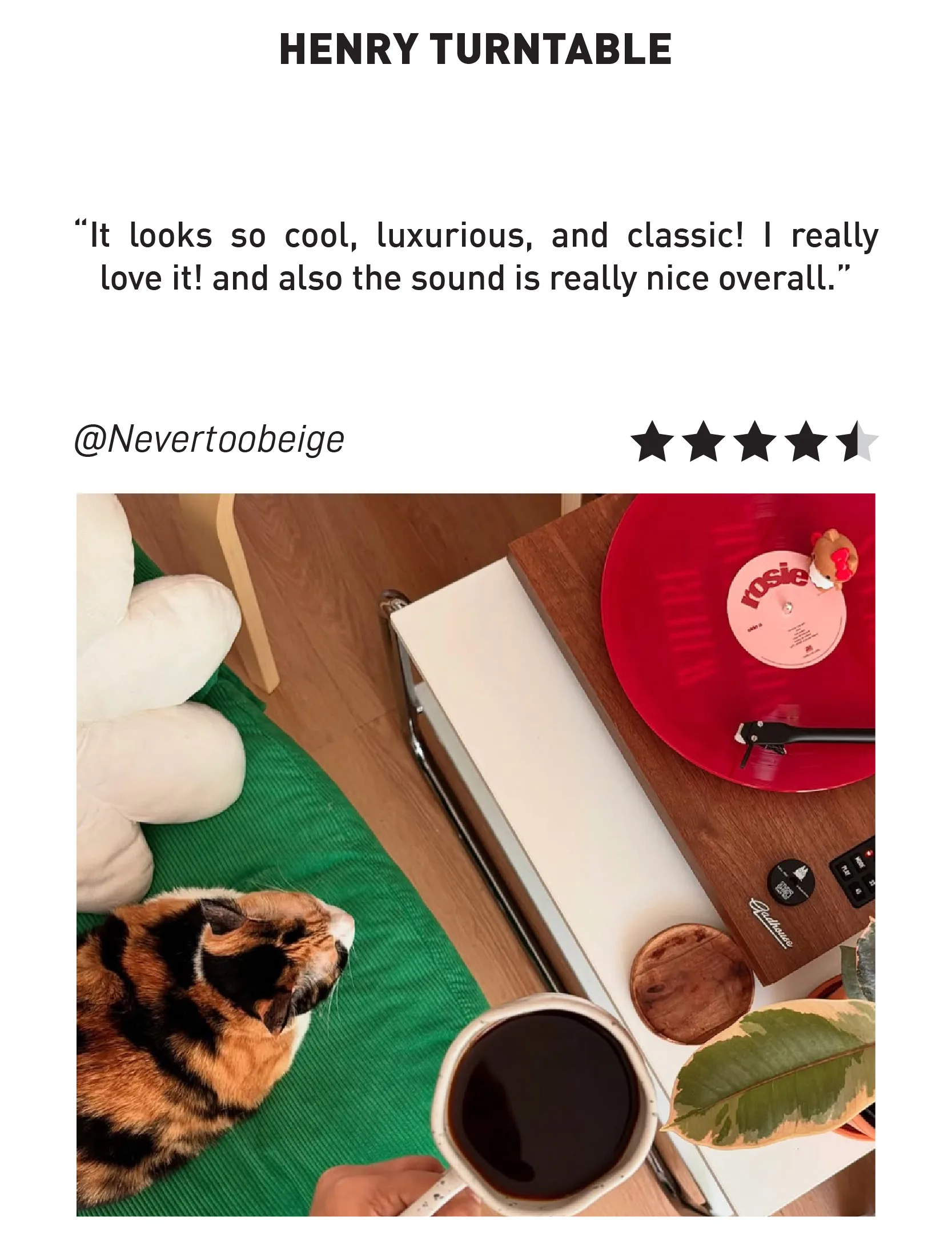 Gadhouse Henry Turntable playing a red vinyl record on a wooden cabinet, with a cozy interior setup and review by @Nevertoobeige