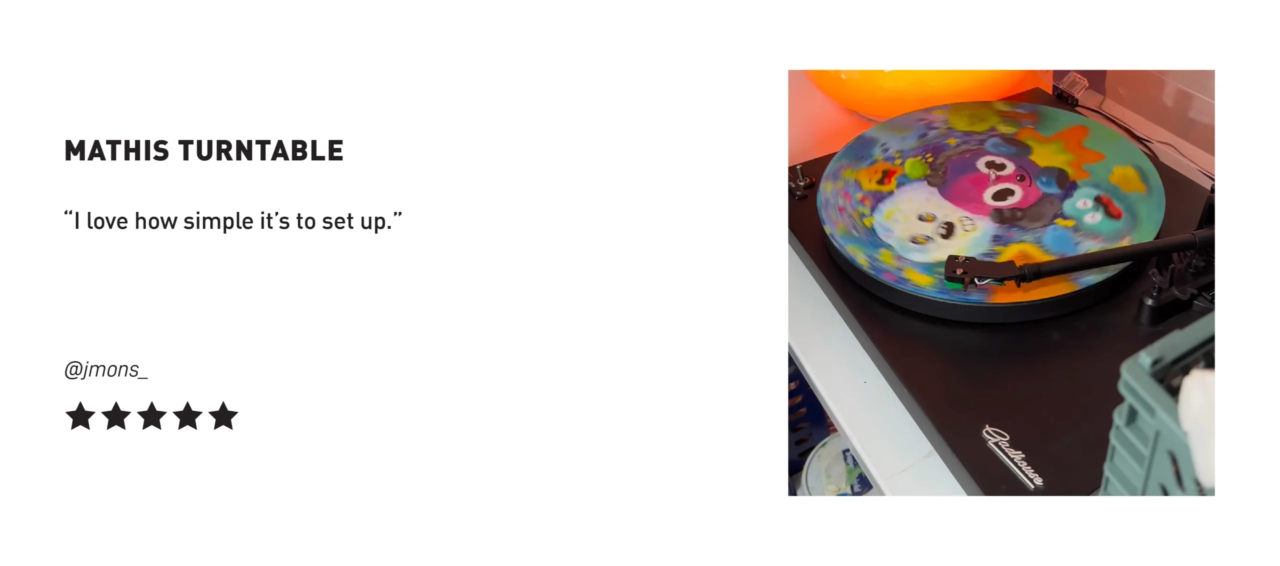 Gadhouse Mathis Turntable playing a colorful illustrated vinyl record, praised for its simple setup by @jmons_